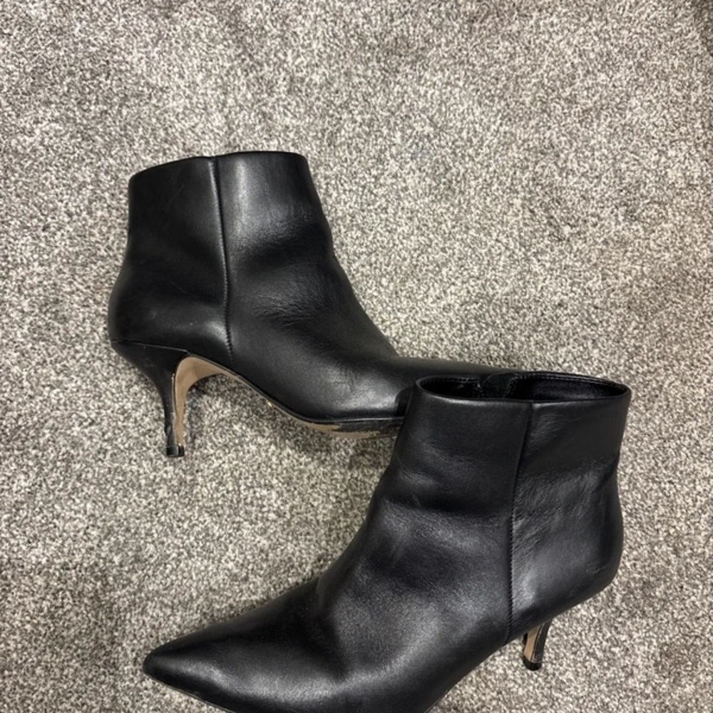 Sleek Black Leather Heeled Boots